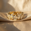 Alternating pear cut moissanite eternity band in 18k gold vermeil on silk background
